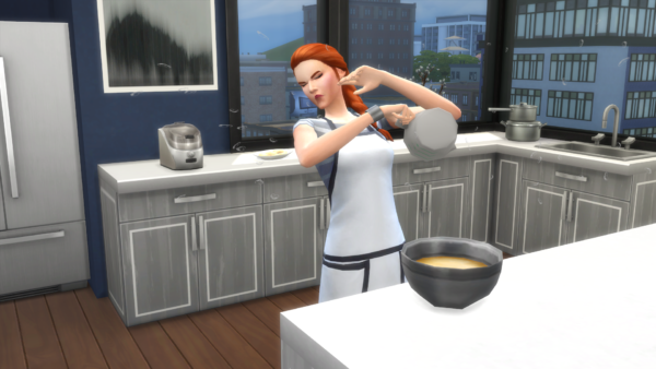 Sim in apron holding a measuring cup gets splashed with water and winces 
